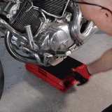 A person using the Motorcycle Lift Jack