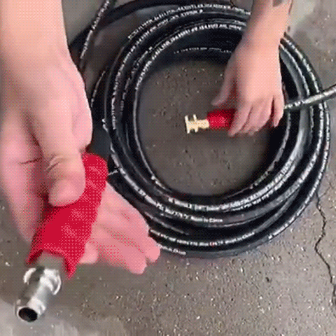 A person using the 50 FT Pressure Washer Hose