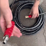 A person using the 50 FT Pressure Washer Hose