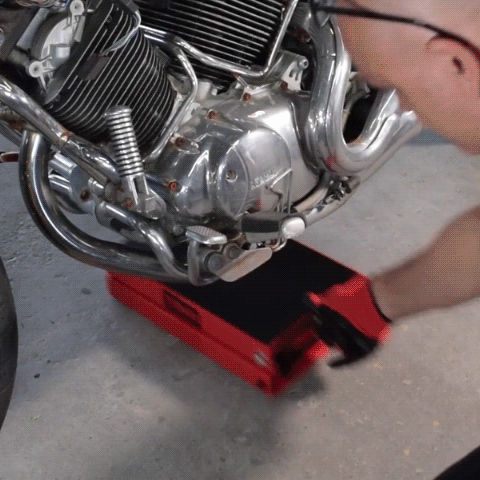 A person using the Motorcycle Lift Jack